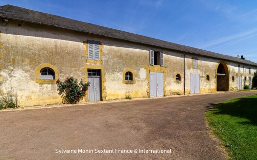 Superbly refurbished estate set on about 6.43 acres, featuring outbuildings and a pool area with a dovecote