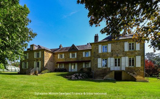 Superbly refurbished estate set on about 6.43 acres, featuring outbuildings and a pool area with a dovecote