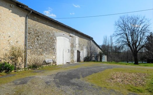 Large stone house with outbuildings