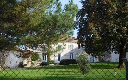 Large stone house with outbuildings