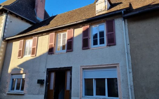 Large house in the centre of town with a large plot of land